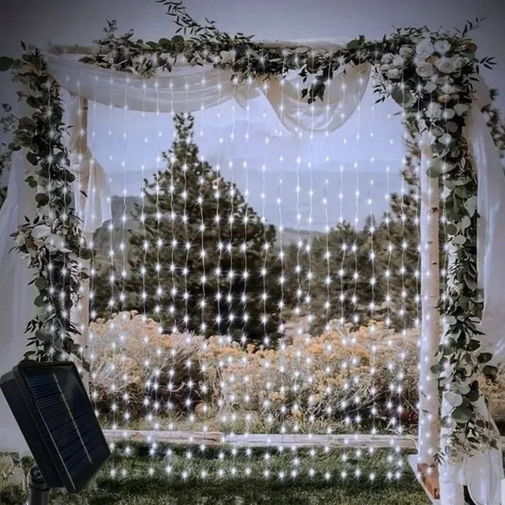 Durable outdoor solar curtain lights, adding ambient glow to garden landscapes.