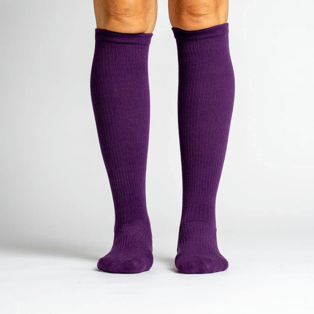 Pair of royal purple unisex compression socks, ideal for circulation and fatigue reduction.