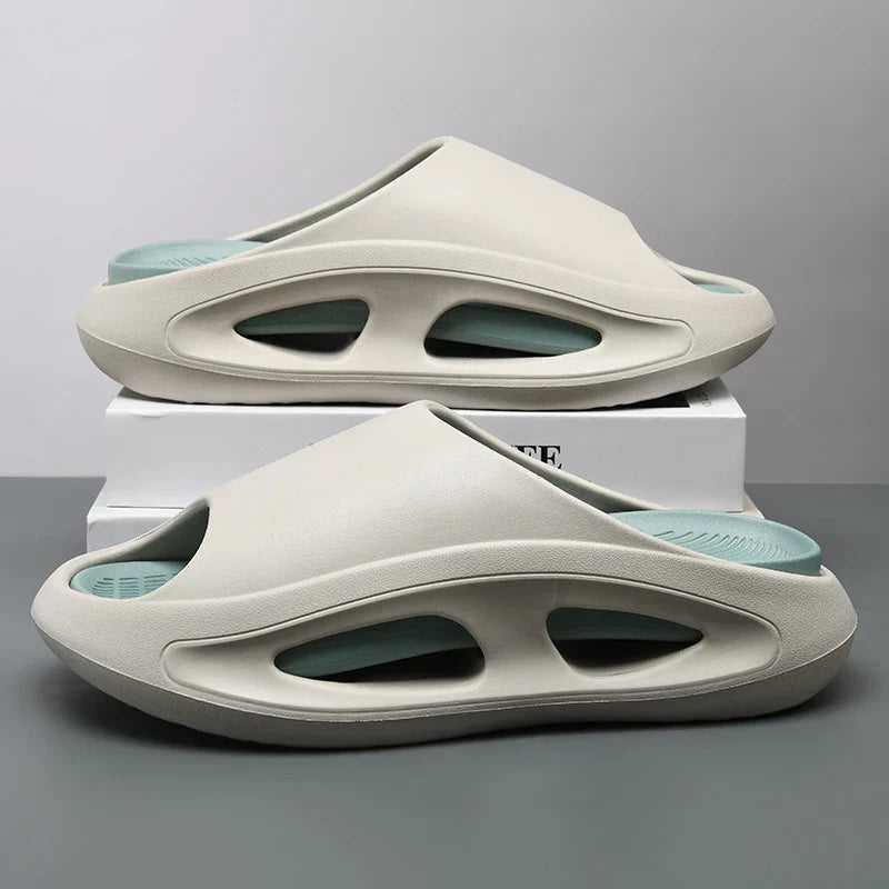 Pair of unisex ultra-soft EVA cloud slides in a neutral color, perfect for casual summer wear.