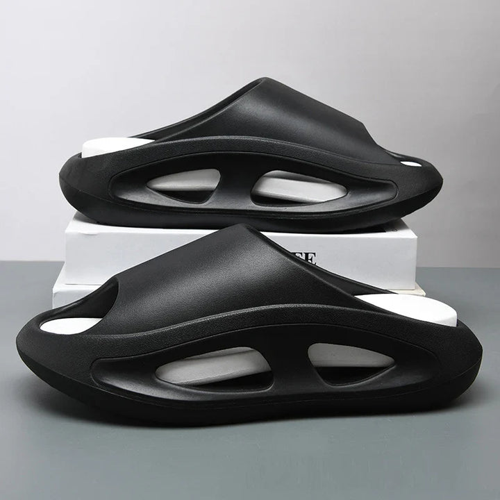 Model wearing a pair of ultra-soft EVA cloud slides, demonstrating their comfortable and lightweight fit for summer.