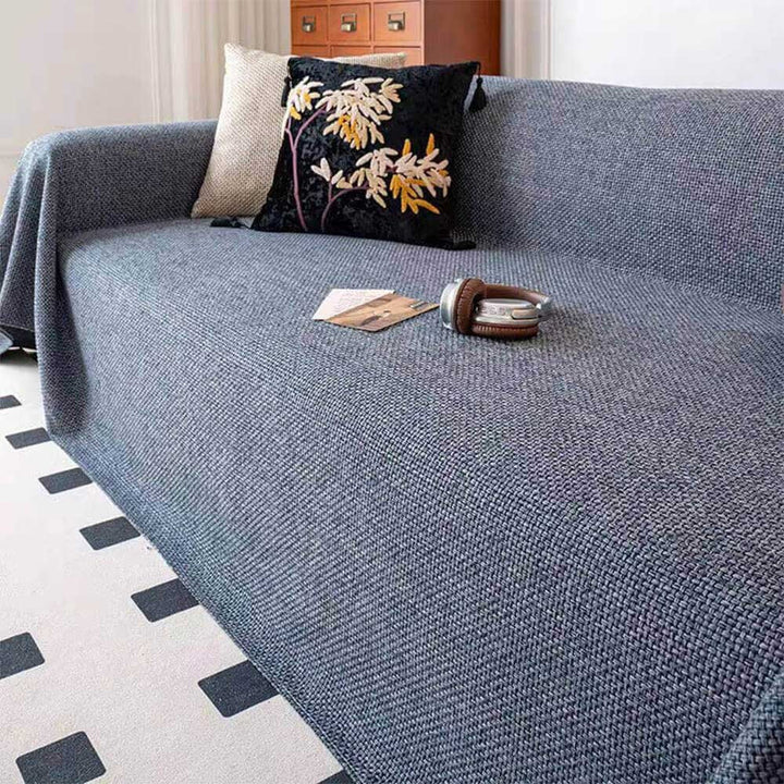 Elegant linen-look sofa cover in polyester. Reversible & durable furniture protector for stylish, pet-friendly living rooms.