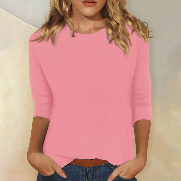 Pink women's casual round neck top with comfortable 3/4 sleeves, perfect for relaxed everyday fashion.