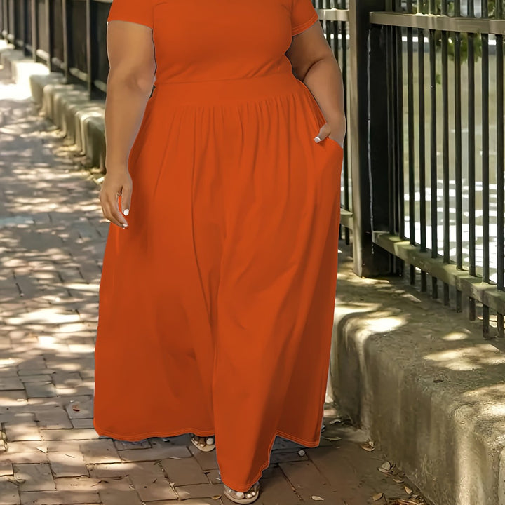 Plus size women's dress, comfortable flowy maxi style, short sleeves, convenient pockets.