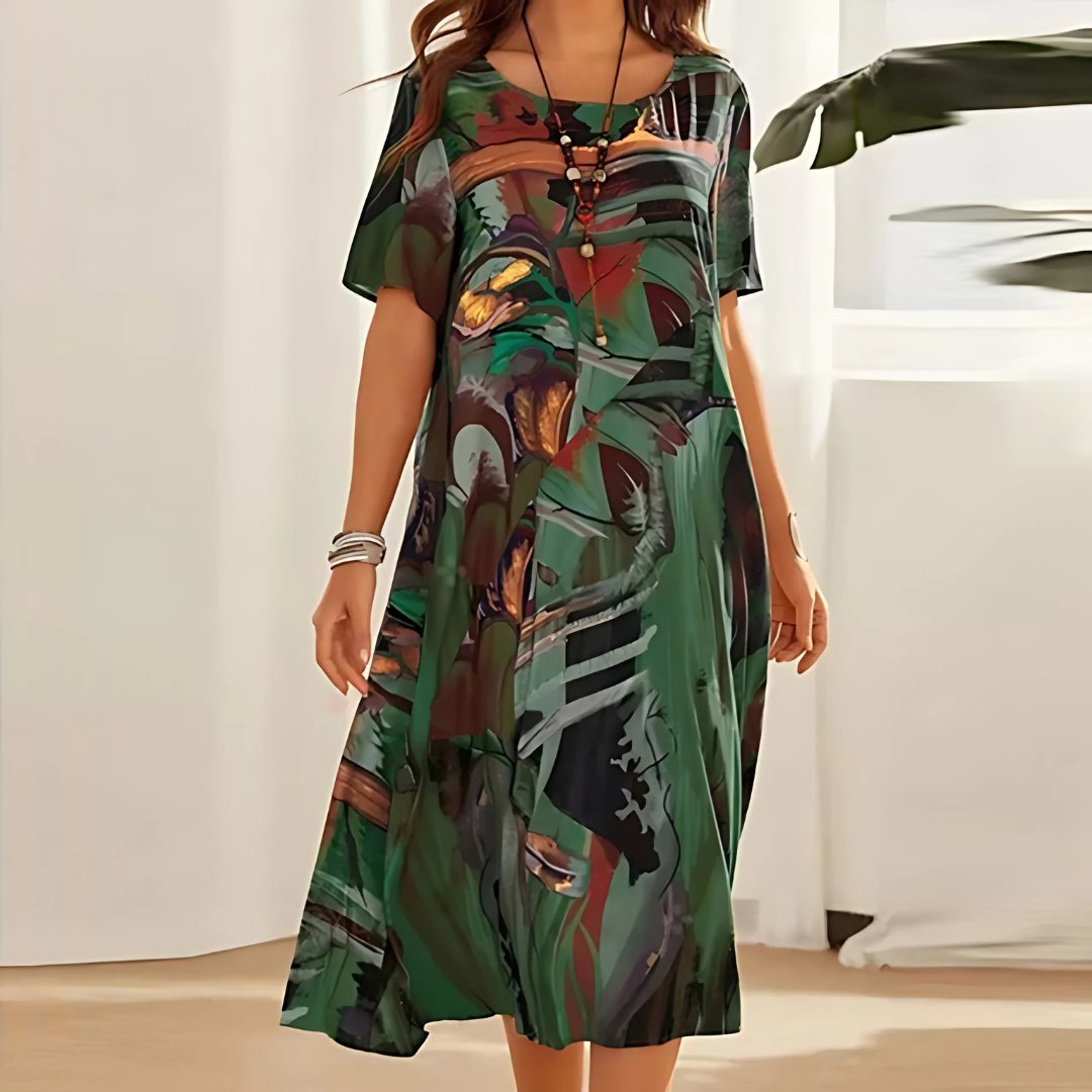 Stylish short sleeve plus size maxi dress featuring a vibrant abstract print, perfect for casual summer wear.