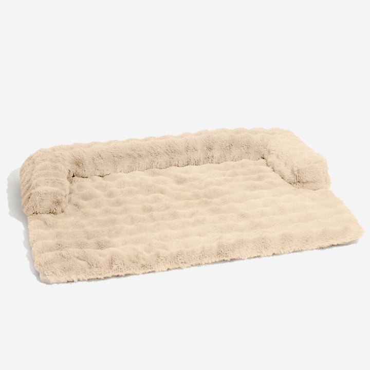 Durable plush dog sofa mat, non-slip backing, protects furniture and offers a cozy pet lounge.