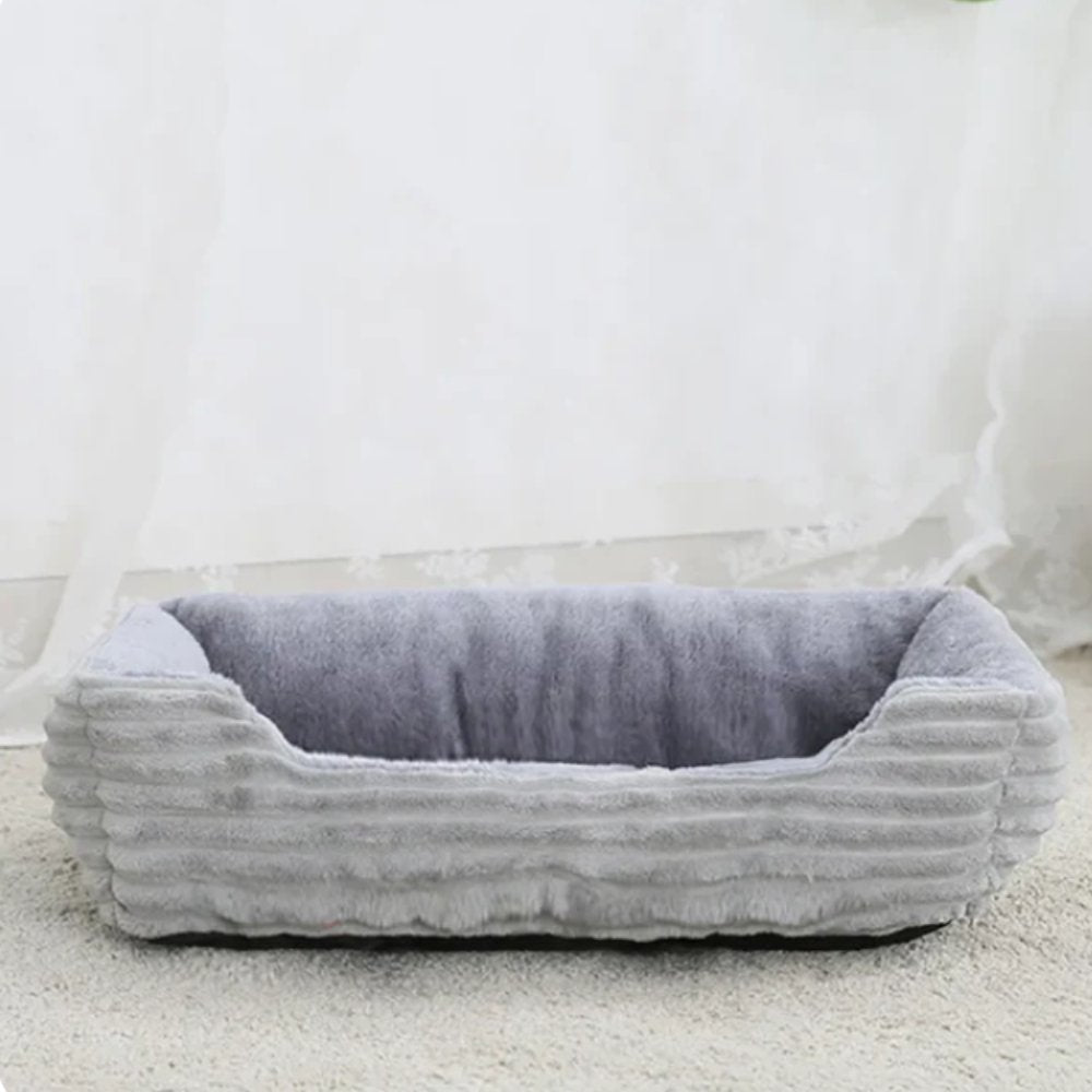 Ultimate comfort plush dog bed. Soft, washable pet bed with non-slip base for easy care.