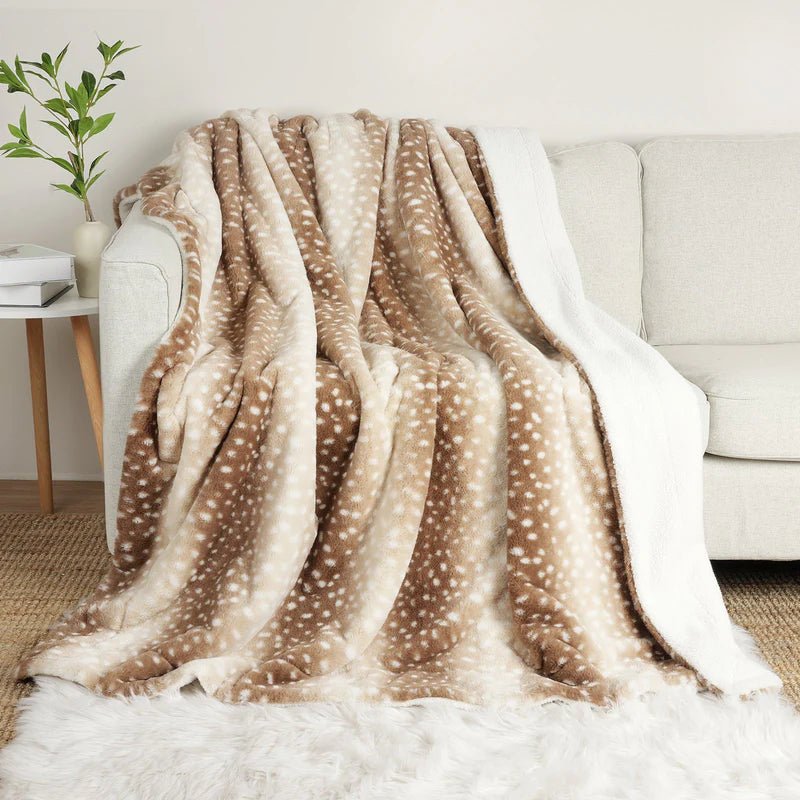 Plush Faux Fur Deer Blanket, reversible for ultimate comfort. Perfect for cozy bedroom or living room decor.