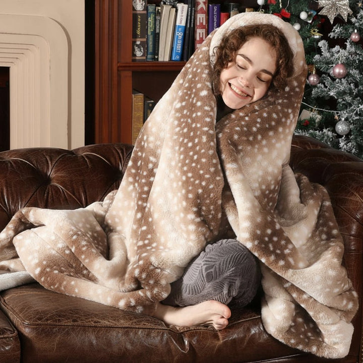 Close-up of soft, plush faux fur deer blanket, highlighting its luxurious texture and animal print.