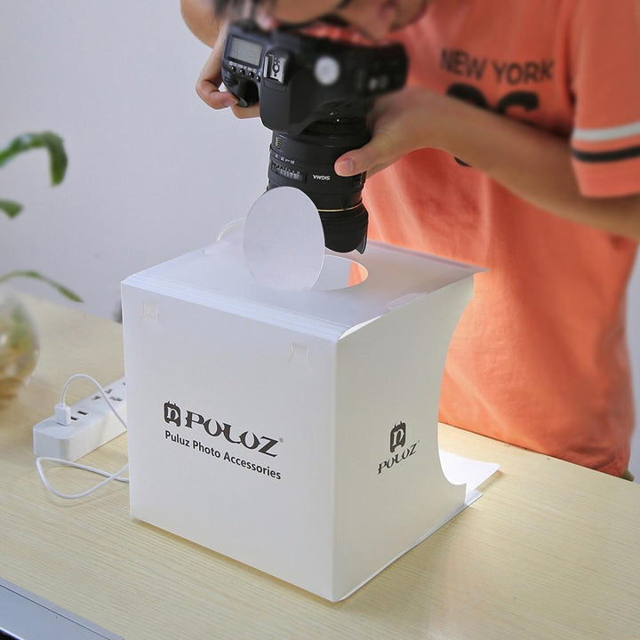 Foldable LED photo studio for product photography. Easy setup, bright illumination for small items.