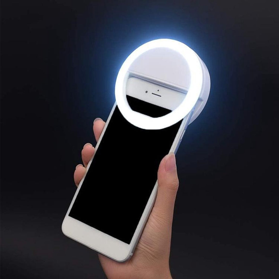 Portable LED selfie ring light for smartphones, perfect for flawless photos & video calls.