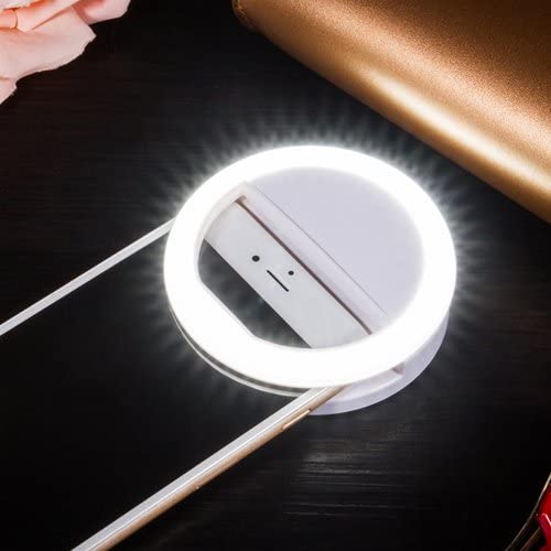 Compact LED ring light for smartphones & laptops, enhances video quality for virtual meetings & streaming.