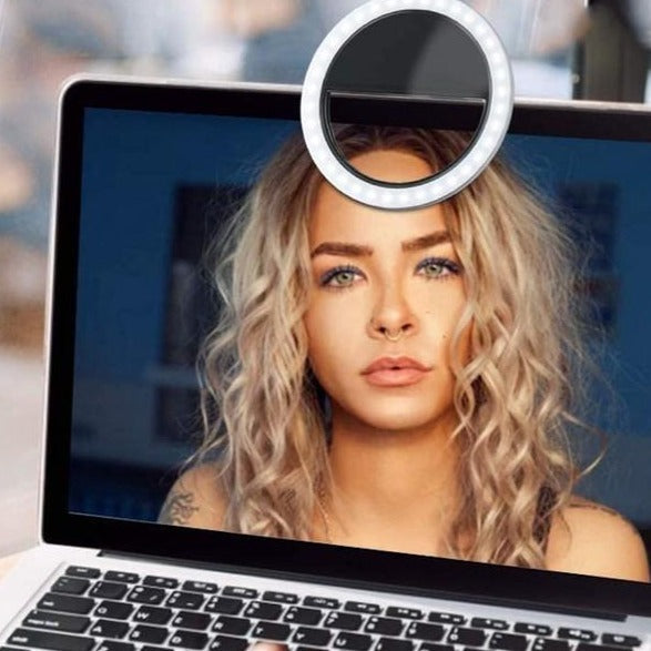 Versatile portable ring light, clips onto phones & laptops, ideal for vlogging, makeup, and live streaming.