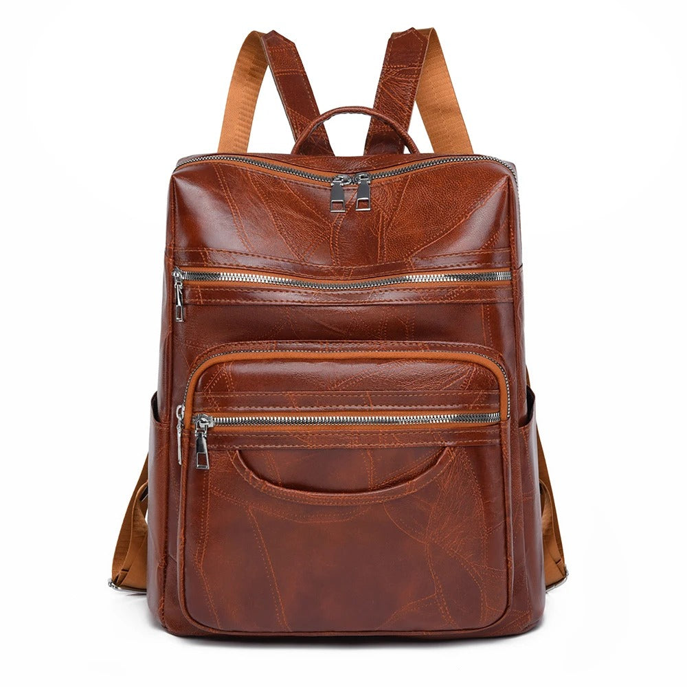 Stylish premium brown leather fashion backpack for women. Versatile everyday bag with comfortable shoulder straps.