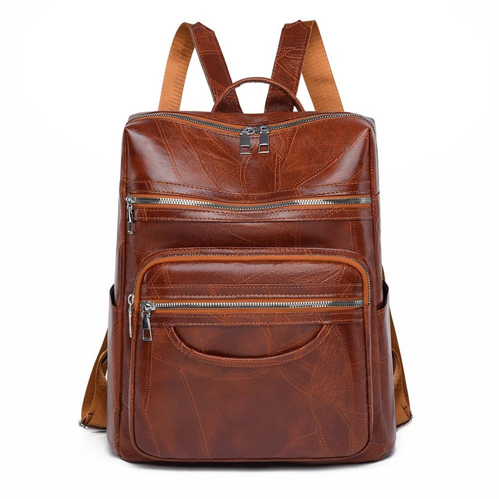 Stylish premium brown leather fashion backpack for women. Versatile everyday bag with comfortable shoulder straps.