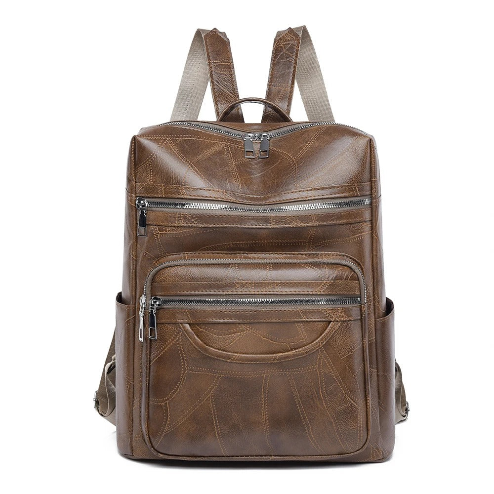 Detail shot of a women's premium leather backpack. Perfect everyday bag, combining style & practicality for travel.