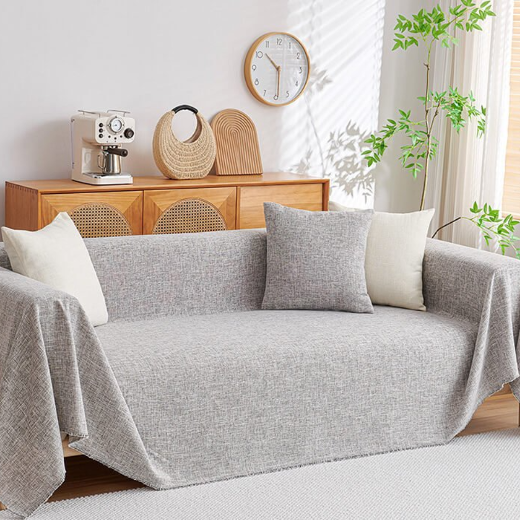 Durable cotton linen sectional cover in cream or navy, a pet-friendly furniture protector for L-shape sofas & home decor.