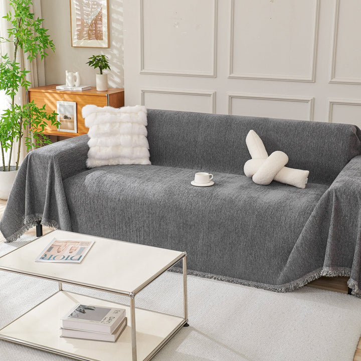 Flexible fit sofa cover enhancing living room decor. A comfortable, durable, and easy-care slipcover for family homes.