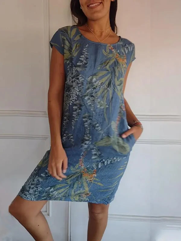 Chic women's printed summer dress with a round neck. Knee-length and flowy, perfect for elegant casual wear.