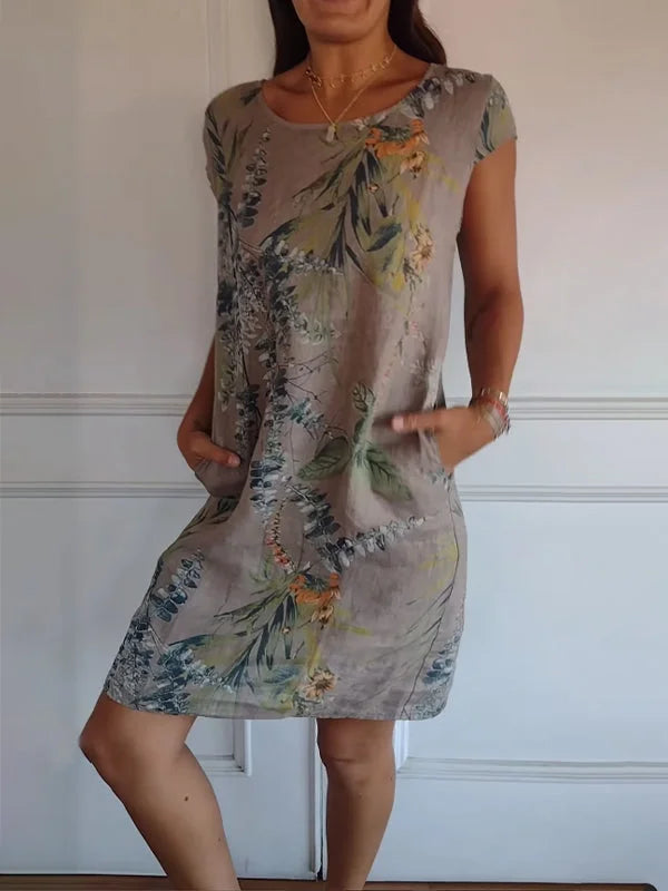 Vibrant women's casual printed dress with a round neckline. Knee-length, flowy, and comfortable for summer.