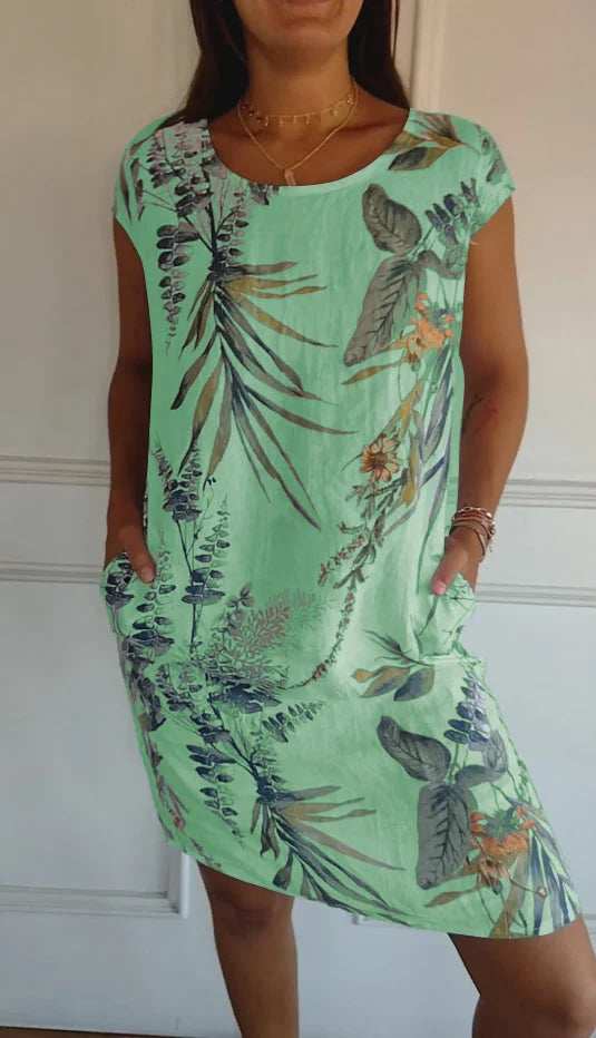 Full view of women's versatile printed round neck dress. Knee-length, flowy fabric, ideal for summer style.
