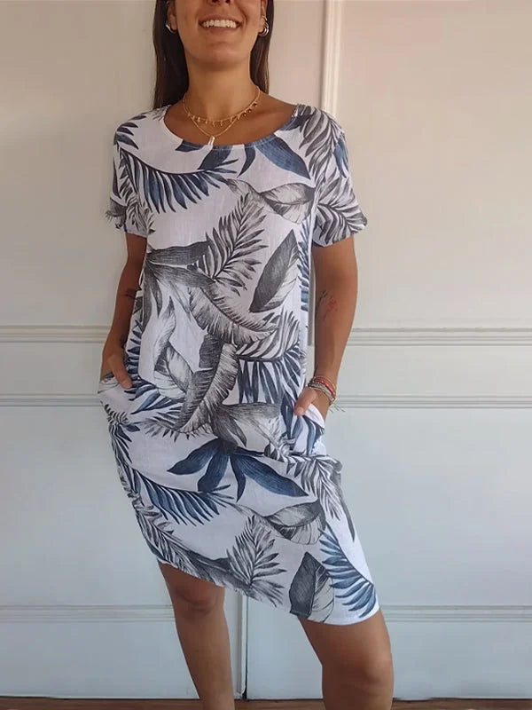 Elegant women's knee-length printed round neck dress. Versatile flowy design for stylish summer outfits.