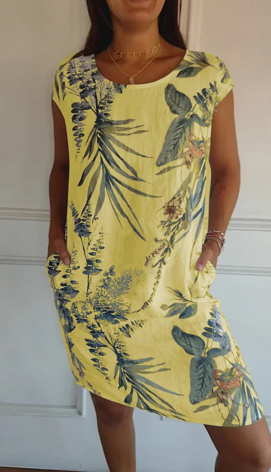 Effortless women's knee-length printed dress with a round neck. Flowy design for stylish summer comfort.