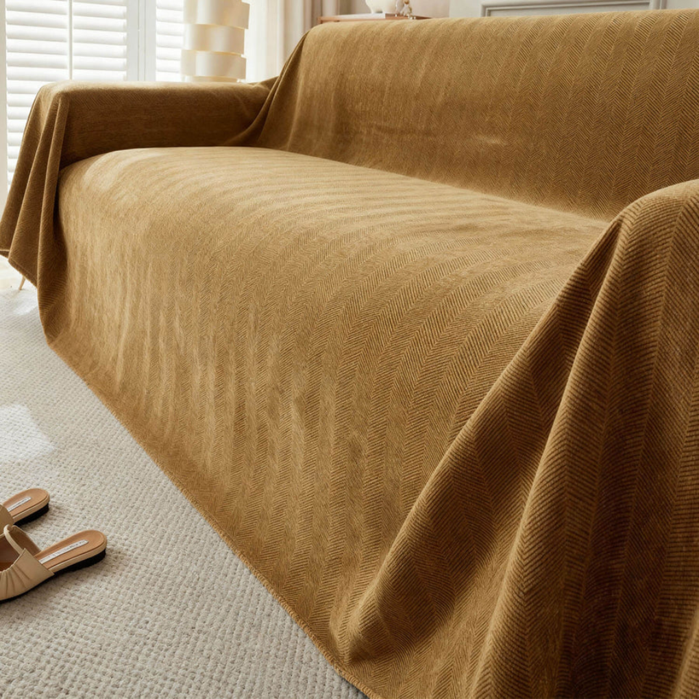 Durable geometric slipcover for sectional couches, offering pet-friendly protection and modern living room style.