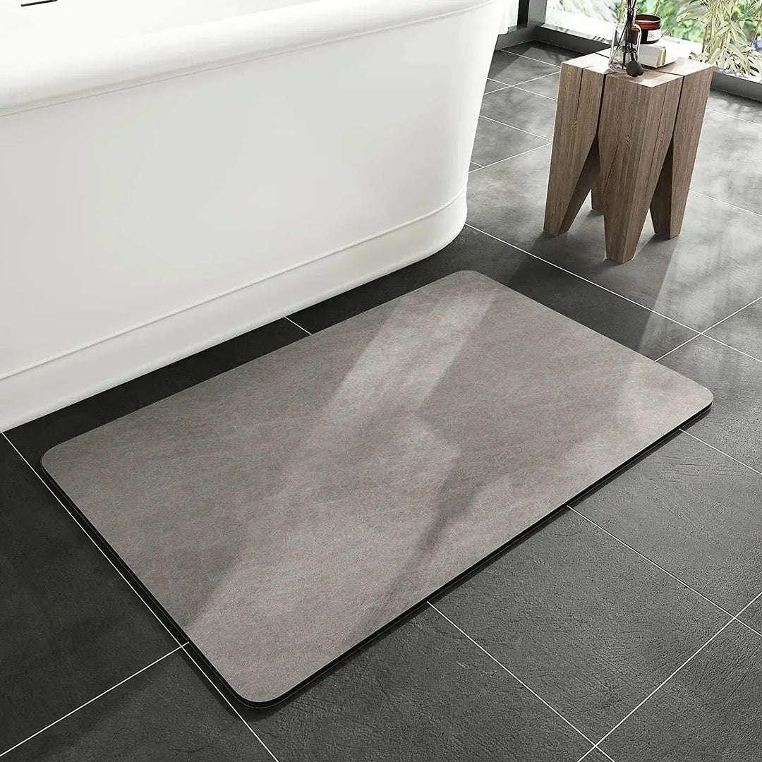 Close-up of quick-dry diatomite bath mat texture, showing its absorbent, anti-slip surface. Eco-friendly design.
