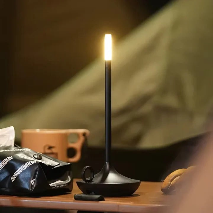 Sleek white LED touch table lamp. Rechargeable & dimmable, offering versatile ambient lighting for any room.