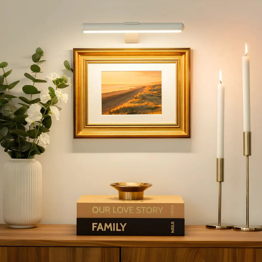 Sleek LED art light. Rechargeable wireless wall sconce provides focused illumination for pictures & home decor.