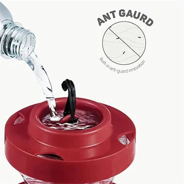 Pest-proof hummingbird feeder with integrated ant moat & bee guards. Ensures clean, safe nectar for tiny birds.