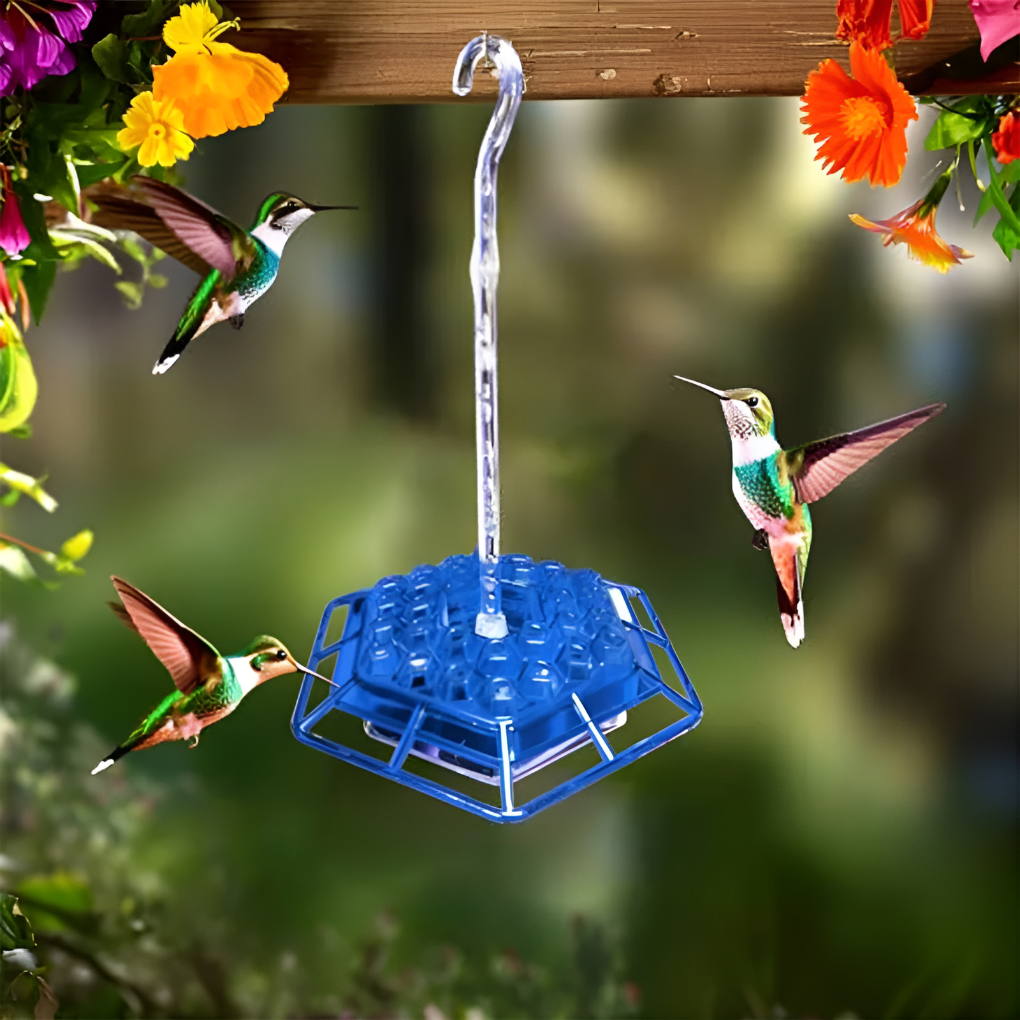 Close-up of a vibrant red hummingbird feeder, showcasing its built-in ant moat and bee guard. Ideal for garden decor.