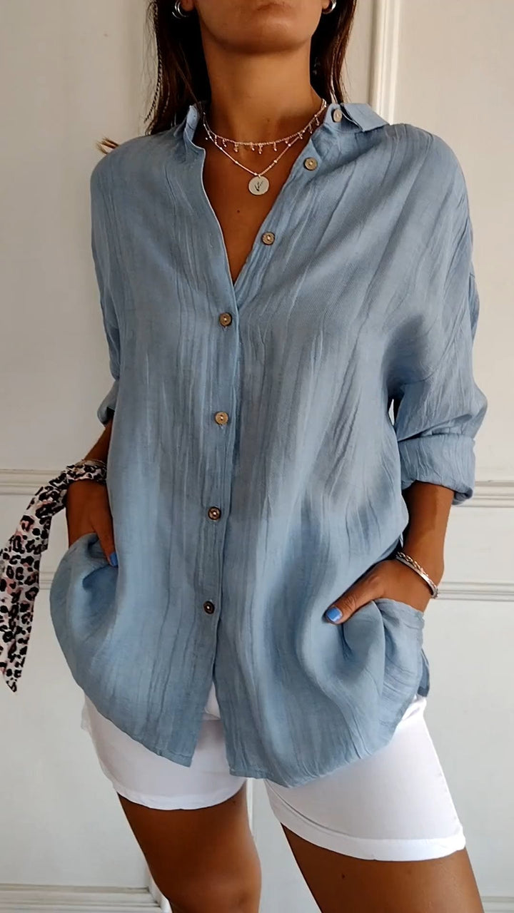 Relaxed fit women's long sleeve button-down shirt, a versatile casual top.