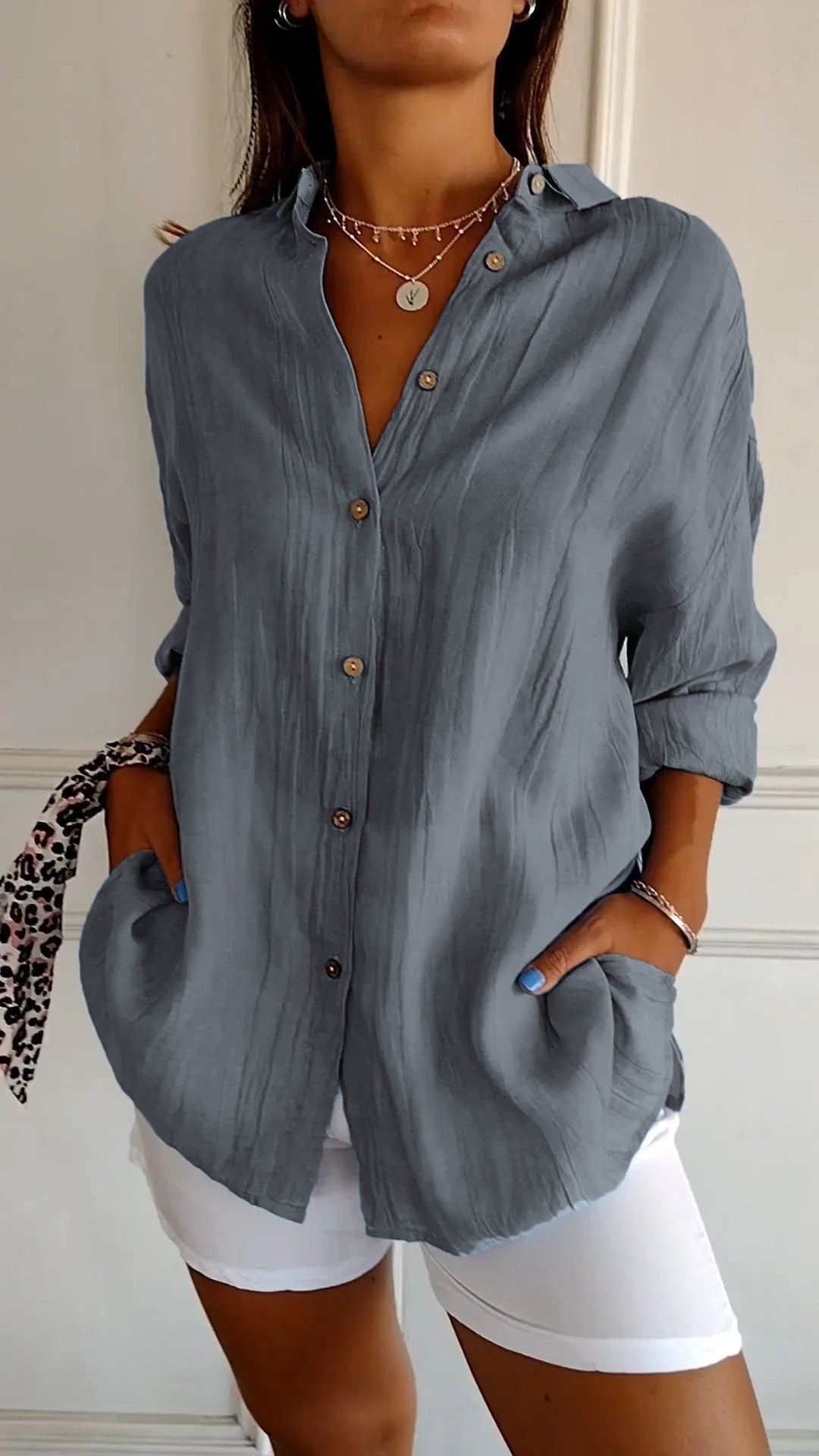 Versatile women's button-down shirt, perfect for layering or stand-alone chic style.