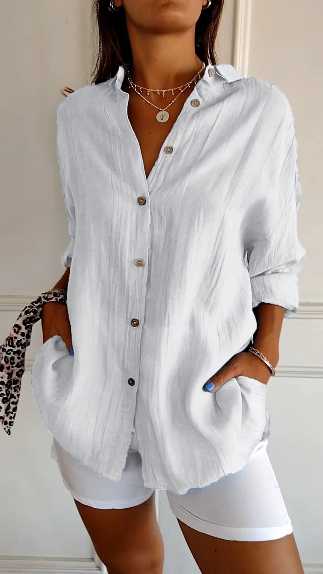 Elegant casual women's button-down blouse, relaxed fit long sleeve design.