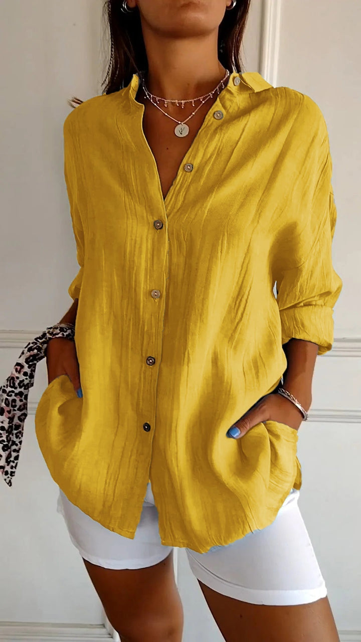 Chic women's relaxed fit button-down top, ideal for versatile summer fashion.