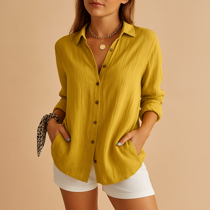Comfortable women's classic long sleeve button-up shirt, ideal for office wear or a chic everyday look.