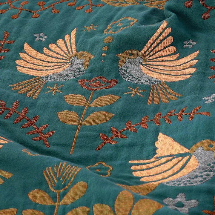 Nordic design bird pattern blanket, a reversible cotton throw for bedroom or living room decor.