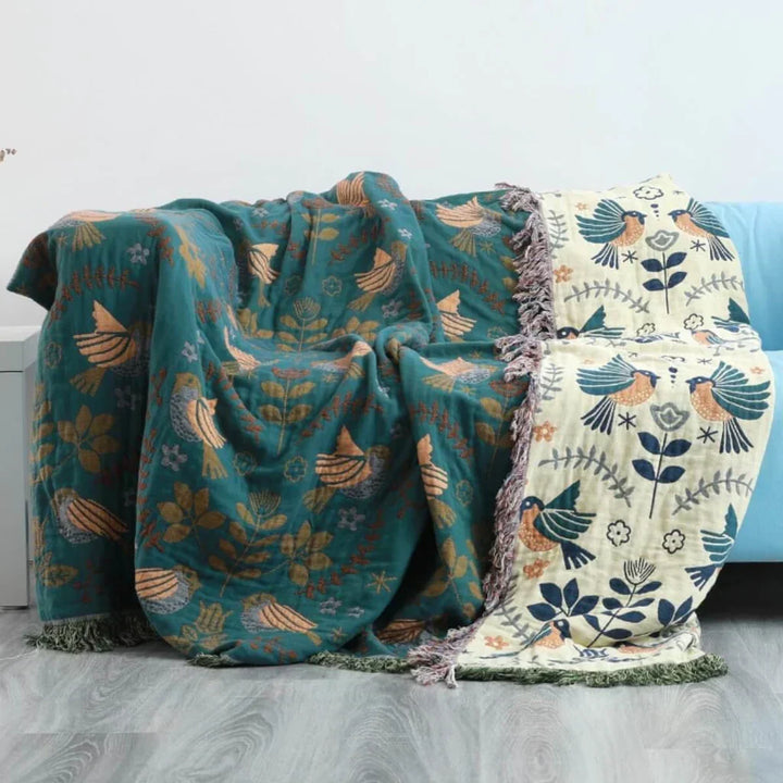 Cozy Scandinavian bird blanket, a decorative and soft cotton throw perfect for home textile accents.