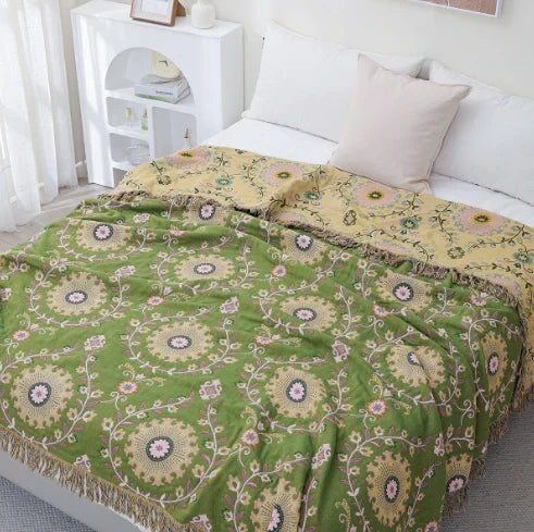 Soft reversible scandinavian bird pattern throw blanket, ideal for cozy home decor in living room or bedroom.