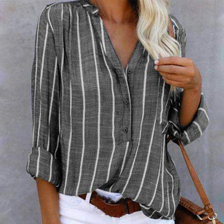 Chic women's striped V-neck button-down blouse, perfect for versatile, casual elegance. Long sleeves.