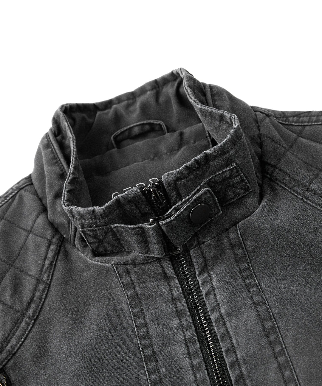 Side profile of a man wearing a rugged charcoal canvas jacket, suitable for motorcycle use.