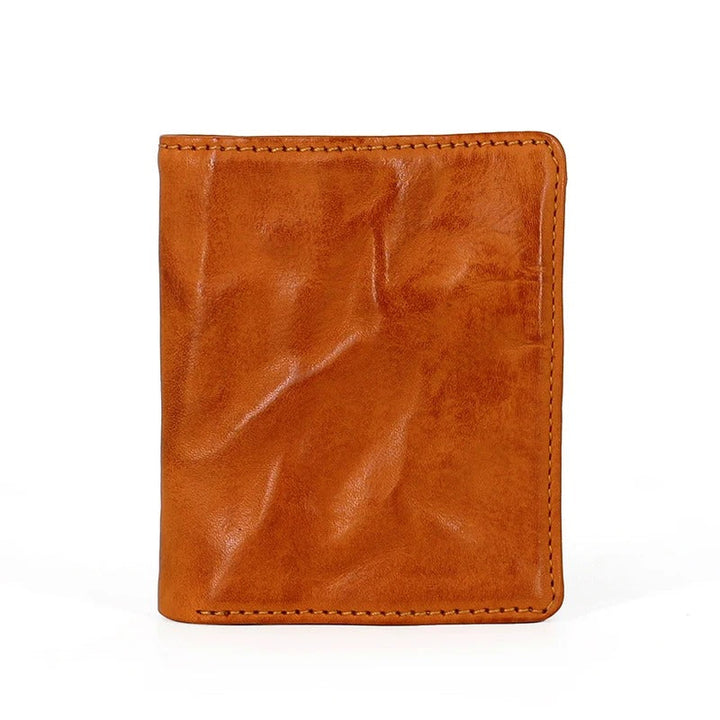Interior of a men's tri-fold wallet showing organized card slots, bill compartment, and ID window
