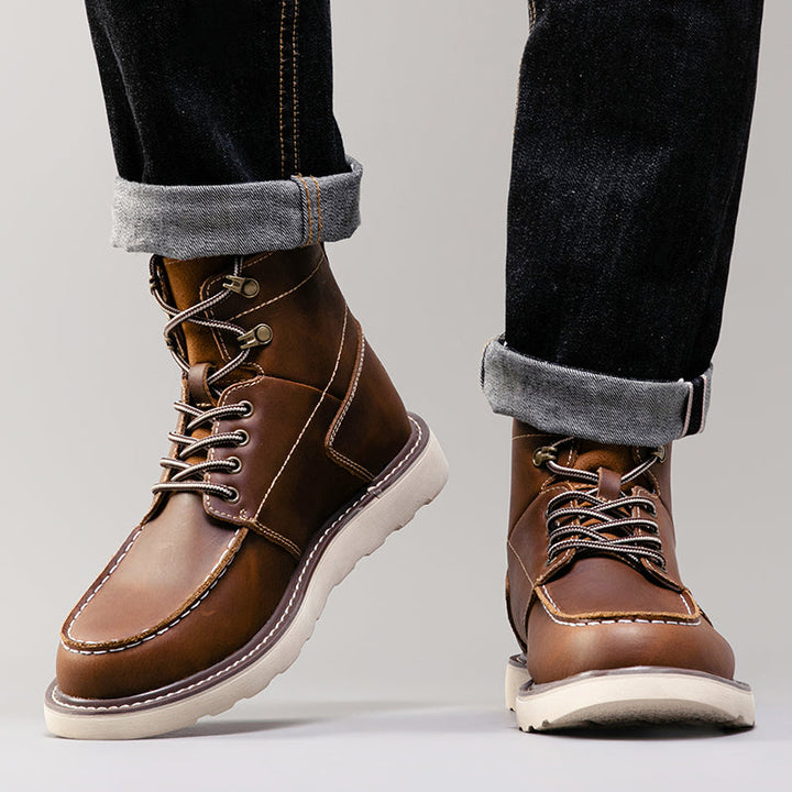 Black waterproof men's chukka boots with contrasting sole, highlighting durable and trendy design