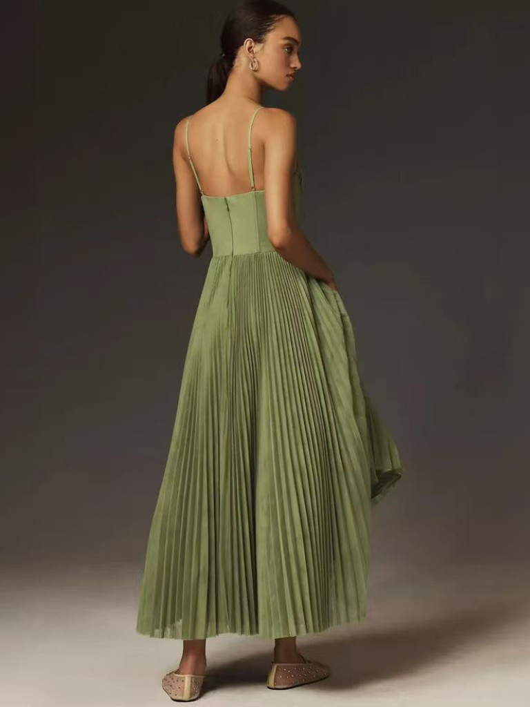 Summer wedding guest maxi dress in sage green, featuring elegant pleats & corset.
