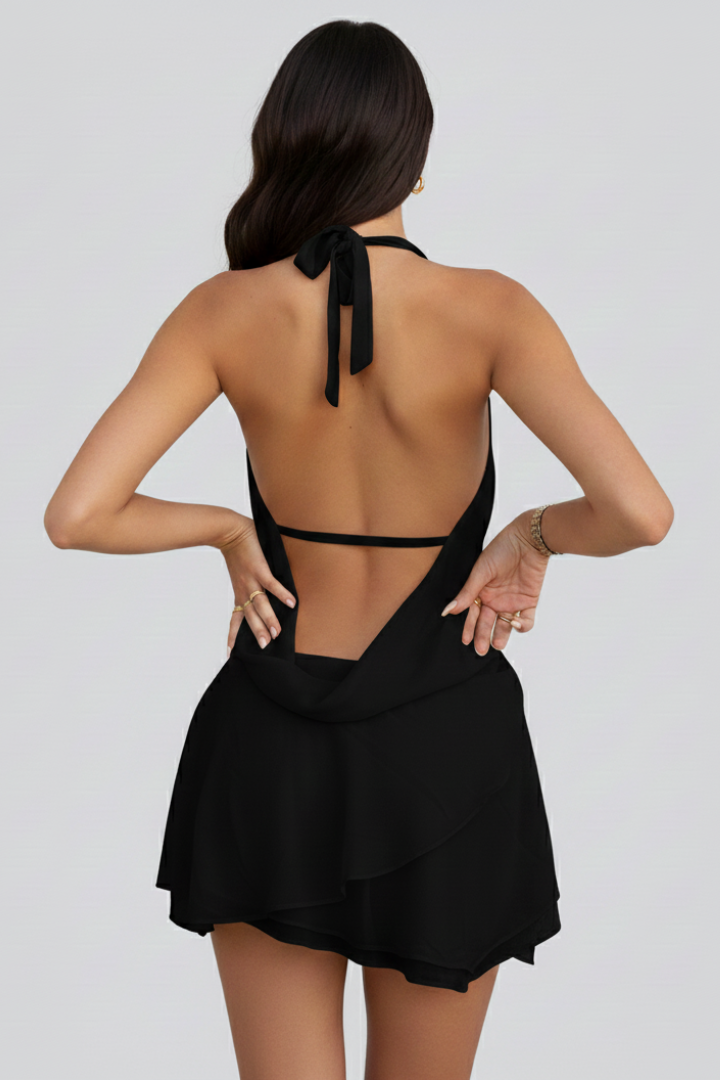 Fashionable women's mini dress, V-neck, and open back design. Perfect elegant cocktail or party attire.