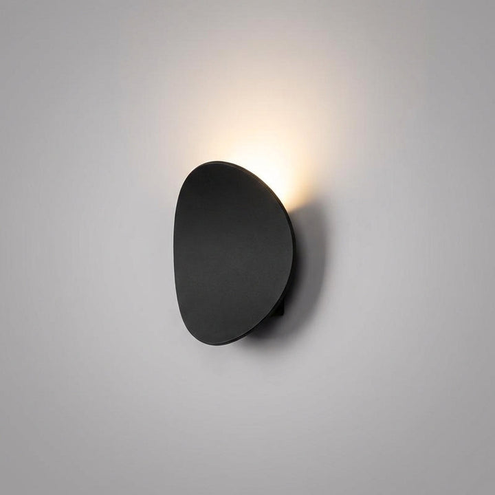 Modern minimalist LED wall sconce, Serevex design for elegant home decor & ambient indoor light.