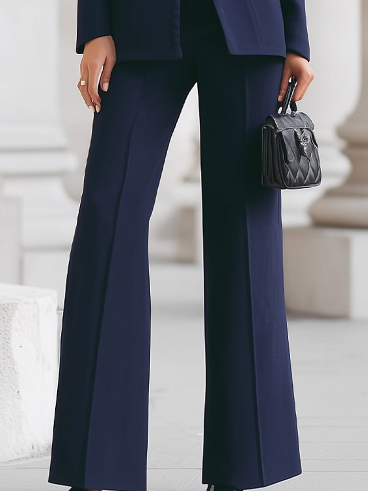 Formal women's Sharie suit set with a tailored blazer and trousers, suitable for business & events.