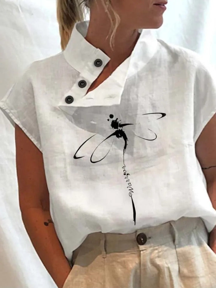 Women's short-sleeve blouse with playful floral print, offering chic comfort for casual & office wear.