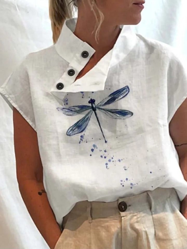 Comfortable women's short-sleeve blouse, showcasing a playful floral print for versatile summer wear.